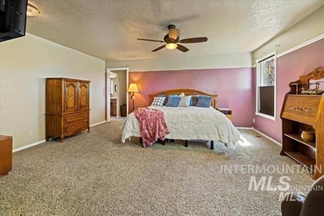 bedroom with a textured ceiling, carpet, a ceiling fan, and baseboards