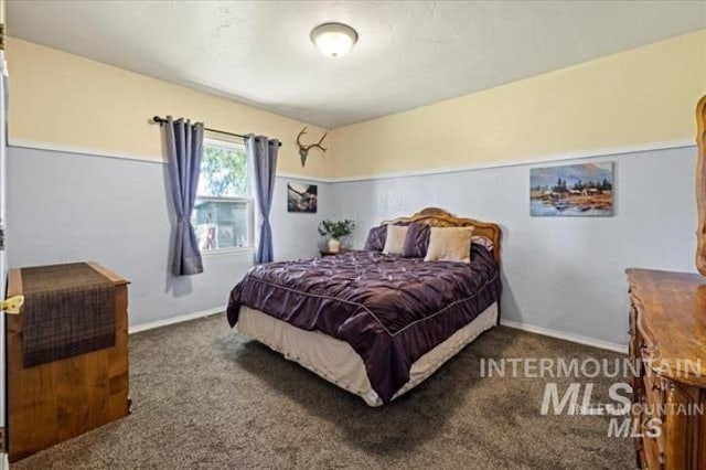 carpeted bedroom with baseboards