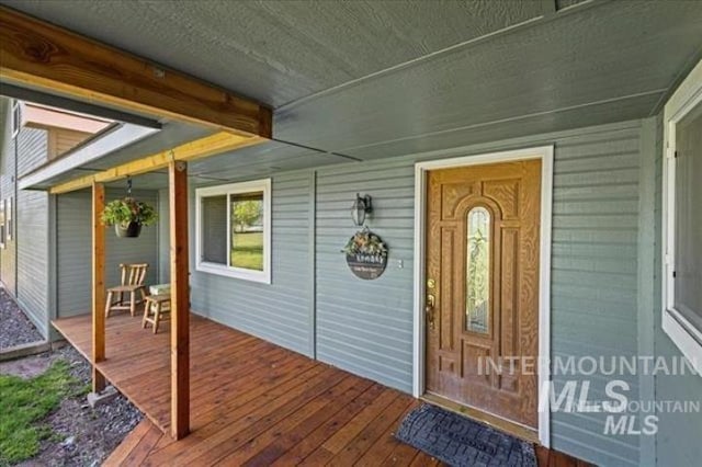 doorway to property featuring a porch