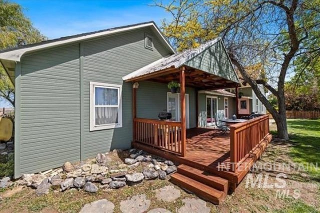 view of property exterior with fence