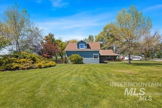 view of property exterior featuring a lawn