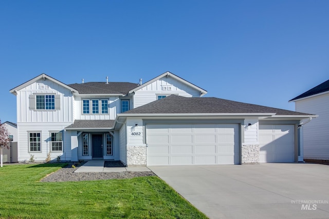 view of front of house featuring a garage and a front lawn