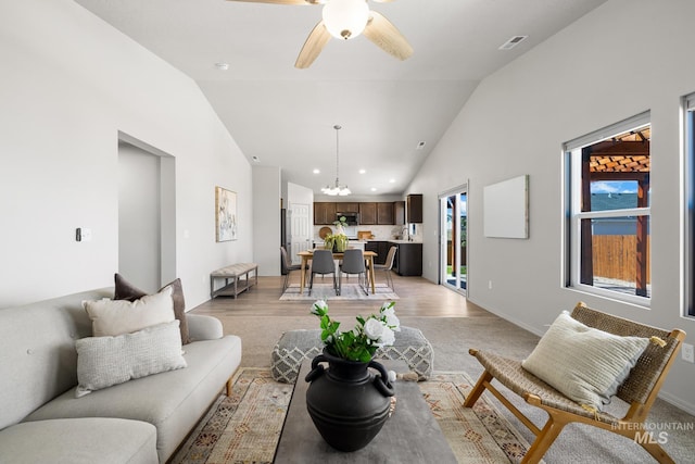 12850 Conner St, Caldwell, ID 83607 - living area featuring recessed lighting, ceiling fan, high vaulted ceiling, baseboards, and a chandelier
