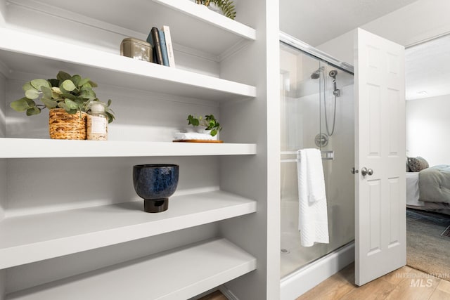 12850 Conner St, Caldwell, ID 83607 - ensuite bathroom featuring a stall shower and wood finished floors
