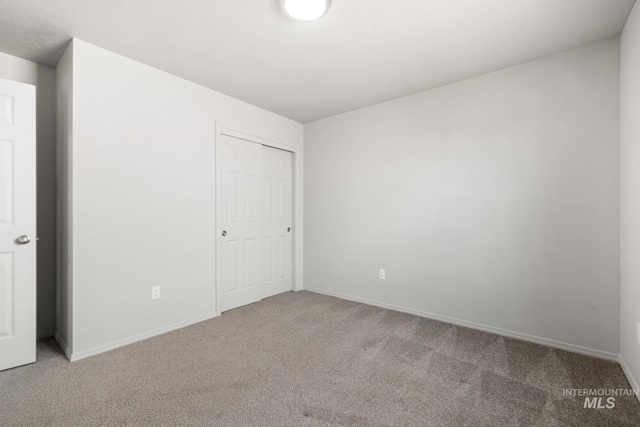 12850 Conner St, Caldwell, ID 83607 - unfurnished bedroom with carpet flooring, baseboards, and a closet