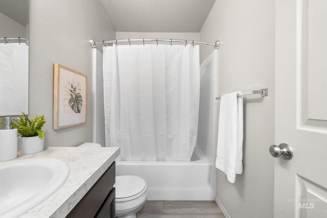 12850 Conner St, Caldwell, ID 83607 - full bathroom featuring vanity, toilet, shower / tub combo, and wood finished floors