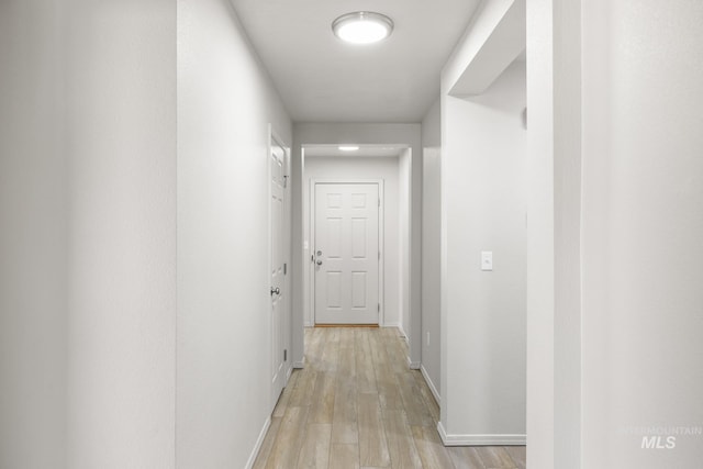 12850 Conner St, Caldwell, ID 83607 - hallway with light wood finished floors and baseboards