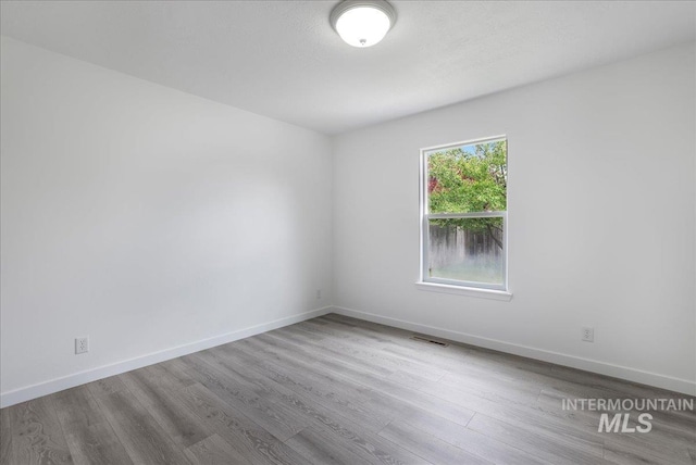 1471 Wrangler St, Twin Falls, ID 83301 - empty room featuring wood finished floors and baseboards