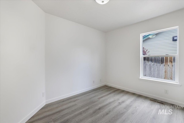 1471 Wrangler St, Twin Falls, ID 83301 - spare room featuring wood finished floors and baseboards