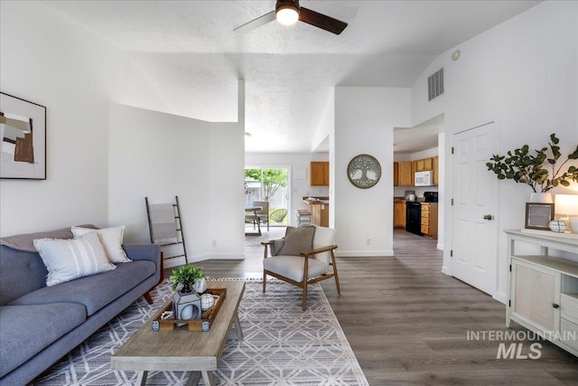 1471 Wrangler St, Twin Falls, ID 83301 - living area featuring lofted ceiling, ceiling fan, wood finished floors, and baseboards