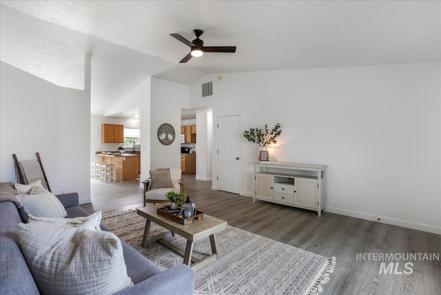 1471 Wrangler St, Twin Falls, ID 83301 - living room featuring lofted ceiling, ceiling fan, wood finished floors, and baseboards