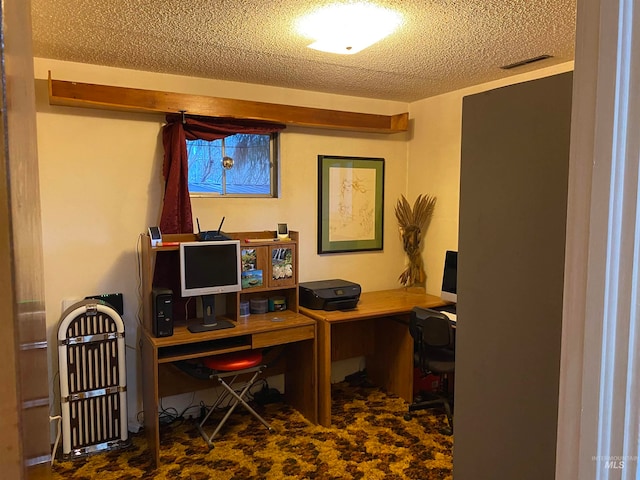 office space featuring a textured ceiling