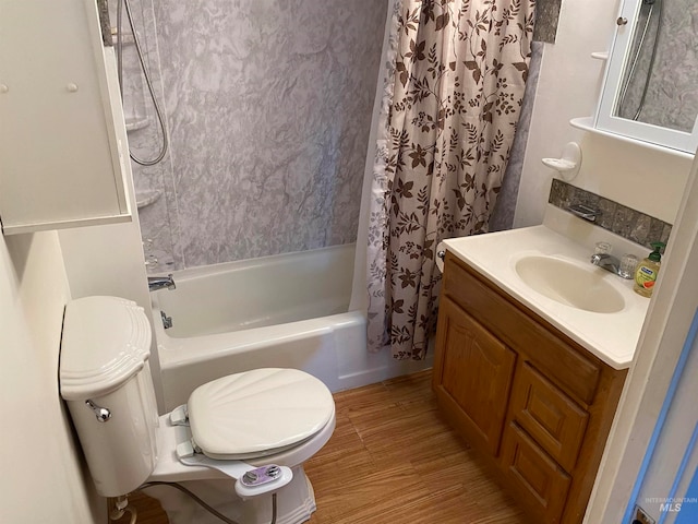 full bathroom with shower / tub combo with curtain, hardwood / wood-style flooring, vanity, and toilet