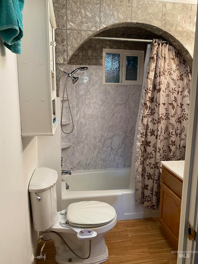 full bathroom featuring shower / bath combo, vanity, toilet, and wood-type flooring