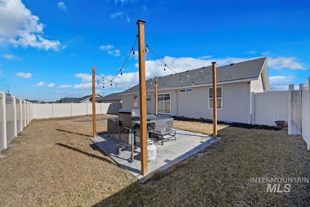 view of yard with a patio area and a fenced backyard