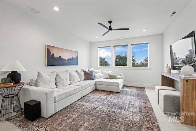 carpeted living area featuring a ceiling fan, recessed lighting, visible vents, and baseboards