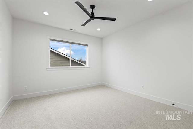 spare room with baseboards, visible vents, carpet flooring, and recessed lighting