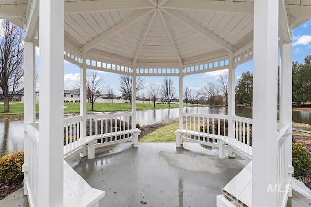 view of patio / terrace featuring a water view and a gazebo