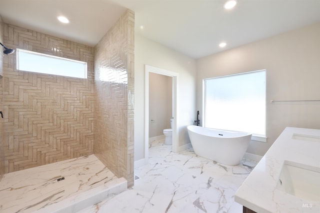 534 Falling Leaf Ln, Twin Falls, ID 83301 - full bath with toilet, double vanity, a freestanding tub, tiled shower, and recessed lighting