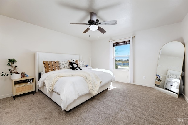 bedroom with ceiling fan and carpet flooring