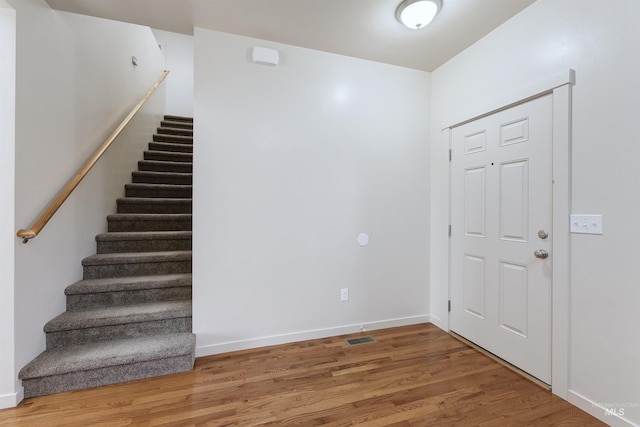 entrance foyer featuring wood-type flooring