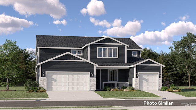 view of front of property with a front yard, covered porch, and a garage