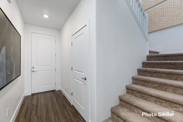 corridor featuring dark hardwood / wood-style floors