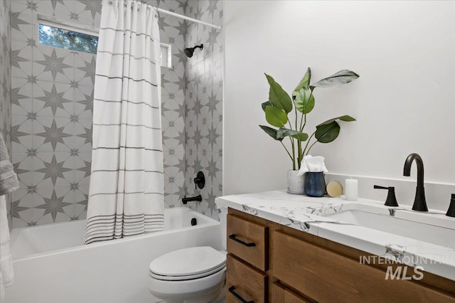 full bathroom featuring toilet, shower / bathtub combination with curtain, and vanity