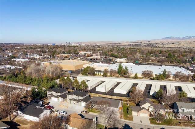 birds eye view of property featuring a mountain view