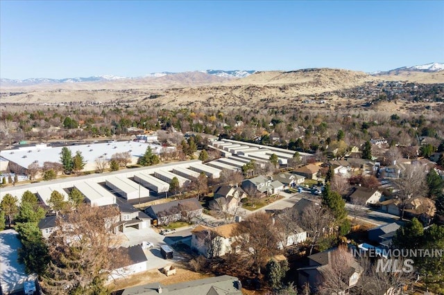 birds eye view of property featuring a mountain view