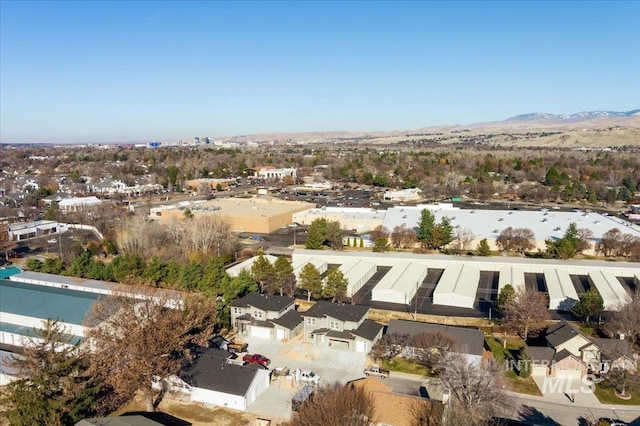 birds eye view of property with a mountain view