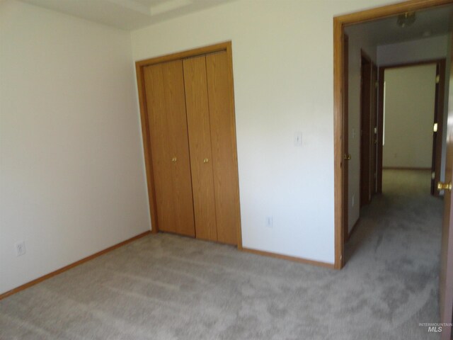 909 W Oakmont Ave, Nampa, ID 83686 - unfurnished bedroom featuring carpet flooring, a closet, and baseboards