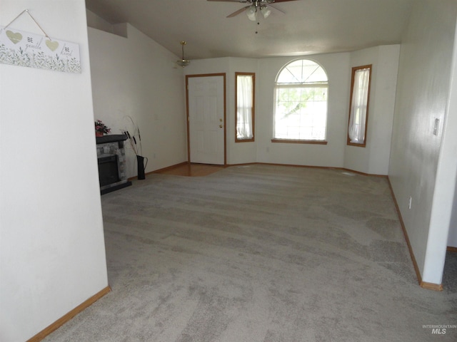 909 W Oakmont Ave, Nampa, ID 83686 - unfurnished living room featuring a ceiling fan, baseboards, and carpet flooring
