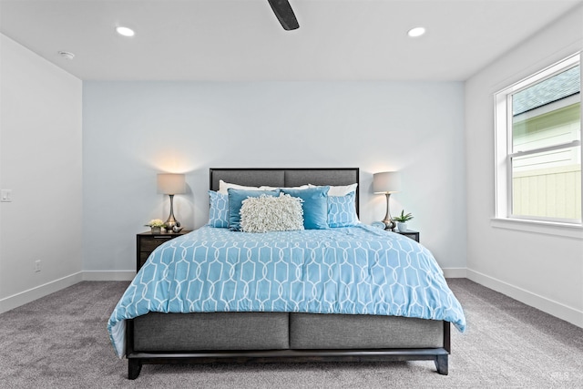 bedroom with ceiling fan and light carpet