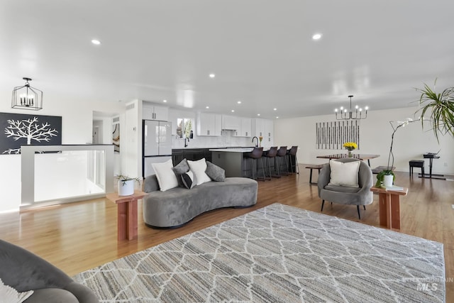 22168 Rio Vista Dr, Caldwell, ID 83607 - living area with recessed lighting, light wood-type flooring, and a chandelier