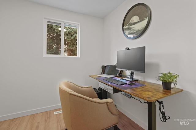 22168 Rio Vista Dr, Caldwell, ID 83607 - home office featuring wood finished floors and baseboards