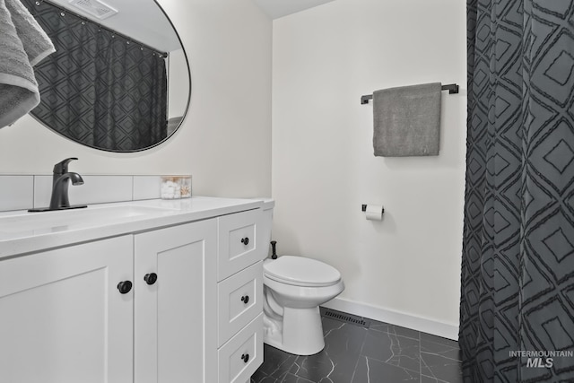 22168 Rio Vista Dr, Caldwell, ID 83607 - full bath with visible vents, toilet, marble finish floor, baseboards, and vanity