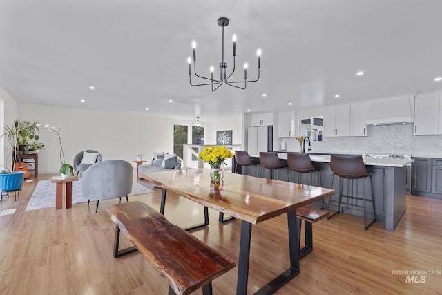 22168 Rio Vista Dr, Caldwell, ID 83607 - dining space with a chandelier, recessed lighting, and light wood-type flooring