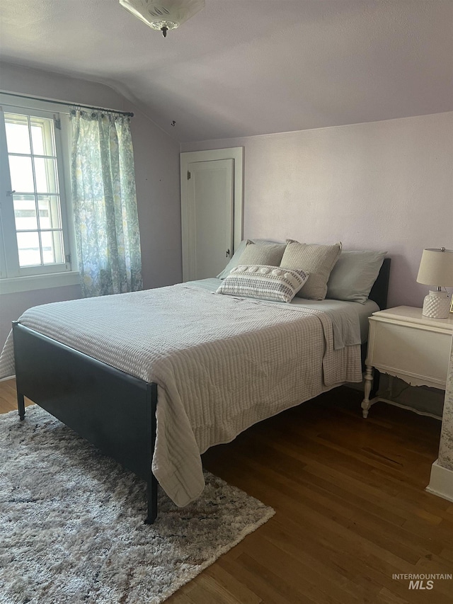 1351 Poplar, Twin Falls, ID 83301 - bedroom with lofted ceiling and wood finished floors