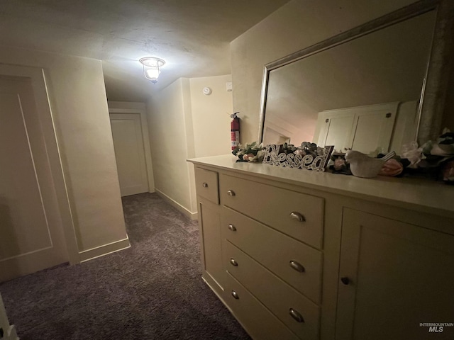1351 Poplar, Twin Falls, ID 83301 - hallway featuring dark carpet and baseboards