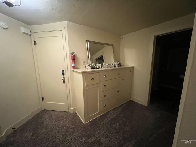 1351 Poplar, Twin Falls, ID 83301 - hall featuring dark colored carpet and baseboards