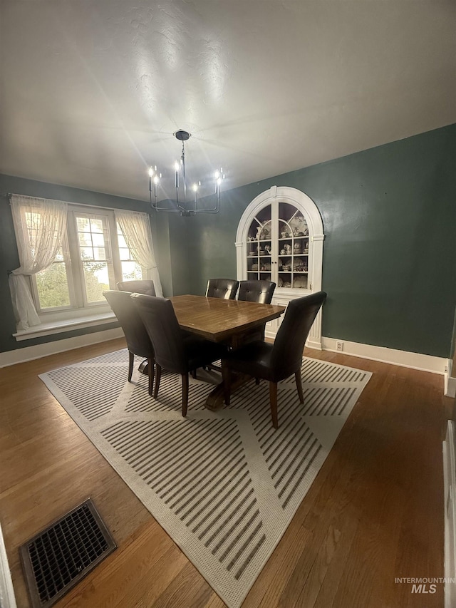 1351 Poplar, Twin Falls, ID 83301 - dining space featuring a chandelier and wood finished floors