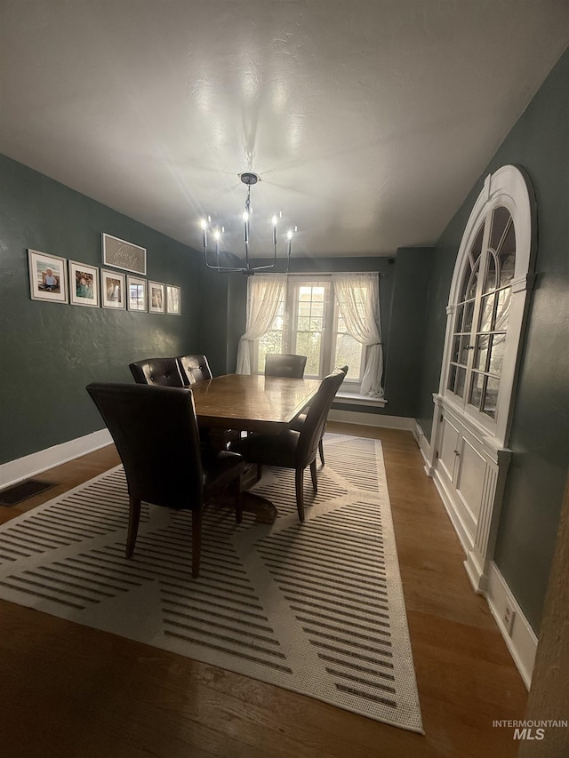 1351 Poplar, Twin Falls, ID 83301 - dining space featuring a chandelier and wood finished floors