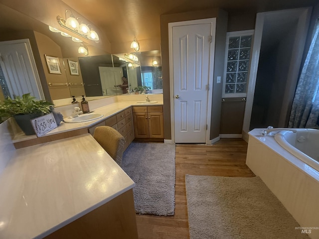 1351 Poplar, Twin Falls, ID 83301 - full bath with double vanity, wood finished floors, a garden tub, and vaulted ceiling