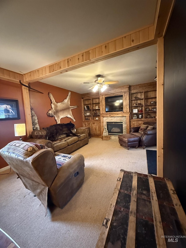 1351 Poplar, Twin Falls, ID 83301 - living room featuring carpet, a large fireplace, a ceiling fan, and built in shelves