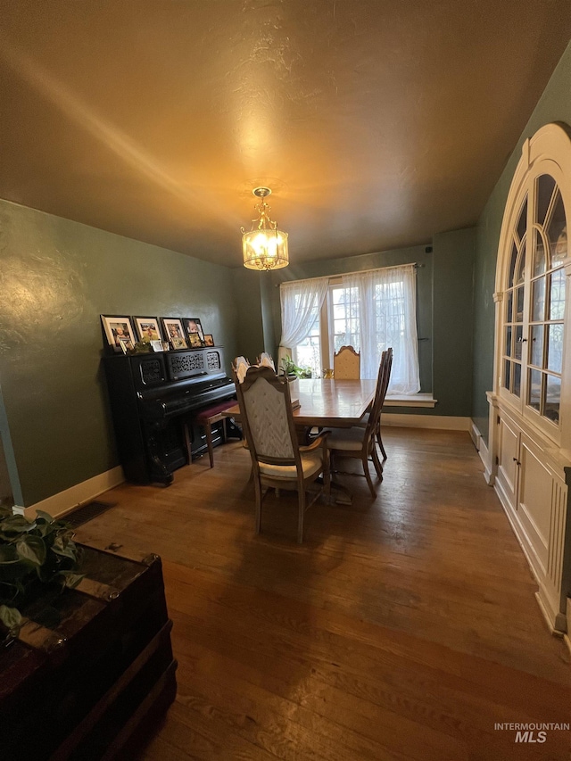 1351 Poplar, Twin Falls, ID 83301 - dining area featuring a chandelier and dark wood-type flooring