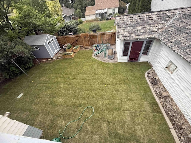 1351 Poplar, Twin Falls, ID 83301 - fenced backyard featuring a storage unit