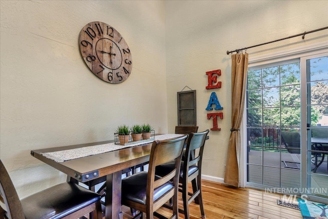 1037 Pahsimeroi Dr, Twin Falls, ID 83301 - dining room with light wood-style floors, baseboards, and a textured wall