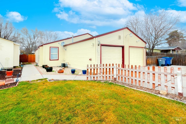 exterior space featuring a yard and a garage