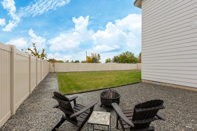 view of yard with a patio area and a fire pit